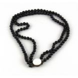 A two row vintage necklace of black cultured pearls, pearl size 6mm necklace L. 40cm.