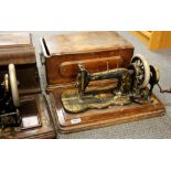 An antique Chas. Todd hand sewing machine with mahogany case, together with a Victoria sewing