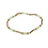 A 9ct yellow gold jade set bracelet, L. 19cm.