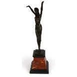 An Art Deco style bronze figure of a dancer after Chiparus on a two colour marble base, H. 56cm.