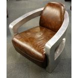 A leather upholstered and aluminium covered aviator's chair, 76 x 76 x 76cm.