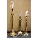 Three good brass column table lamps, tallest 77cm.
