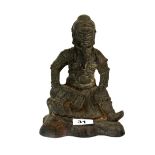 A Chinese cast iron figure of a seated guardian, H. 21cm.