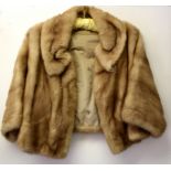 A ladies vintage red squirrel fur coat together with a vintage mink jacket.