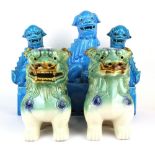 A set of three Chinese turquoise glazed lion dog figures together with a further pair of figures,