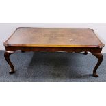 A walnut veneered coffee table with glass inset, L. 117cm H. 46cm.