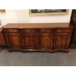 A Regency style mahogany veneered sideboard, W. 193cm.
