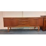 A 1970's teak sideboard, L. 205cm.