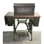 A Singer treadle sewing machine.