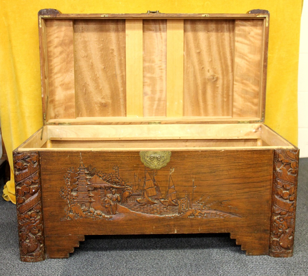 A Chinese mid 20th Century carved camphorwood box (A/F), 95 x 48 x 48cm. - Image 2 of 2