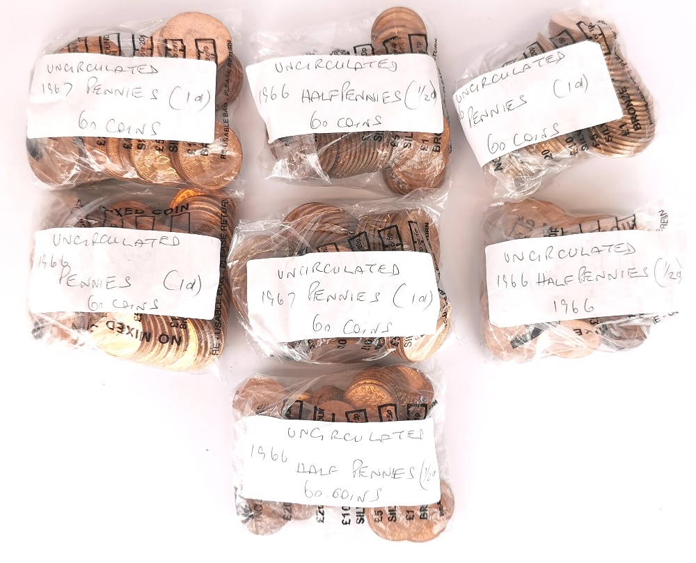A quantity of 1966 and 67 uncirculated pennies and ha'pennies.