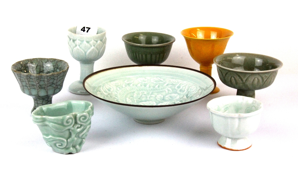 Six Chinese porcelain stem cups, a small porcelain bowl and an incised porcelain dish, tallest H.