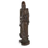 An unusual Chinese carved hardwood figure of an Arhat, H. 45cm. Condition - Some filled age cracking