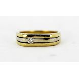 A gentleman's 18ct yellow gold (stamped 750) diamond set ring, (O).