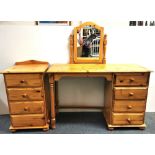 A pine dressing table and chest of drawers, dressing table W. 116cm.