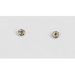 A pair of 9ct white gold (stamped 375) stud earrings set with brilliant cut diamonds, approx. 0.