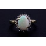 A 9ct yellow gold opal and diamond set cluster ring, (P.5).