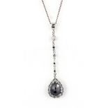 A white metal pendant set with a black diamond approx. 2ct surrounded by white diamonds, together