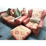 A large very comfortable leather and tapestry upholstered settee and armchair, with footstool.