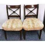 A pair of Regency mahogany upholstered dining chairs.