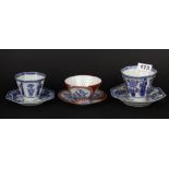 Three fine Japanese porcelain hand painted tea bowls and saucers, tallest 8cm.