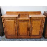 An Art Deco oak sideboard, W. 139cm, H. 97cm.