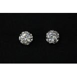 A pair of 18ct yellow gold (stamped 750) diamond set stud earrings, approx. 1.08ct.