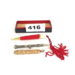A rolled gold propelling pencil, a white metal propelling pencil and one other.