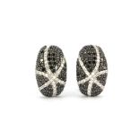 A pair of matching 18ct white gold black and white diamond cluster earrings, approx. 3.22ct, L.