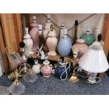 A quantity of ceramic and other table lamps.