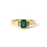 An 18ct yellow gold (stamped 18ct) emerald and diamond set ring, (L.5).