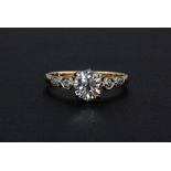 An 18ct rose gold (stamped 18ct) diamond set solitaire ring with diamond shoulders, approx. 1ct, (