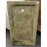 A large early carved stone laundress sink, L. 108cm, W. 61cm, H. 12cm