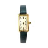 A 9ct yellow gold (375 worn mark) lady's wristwatch on a leather strap.