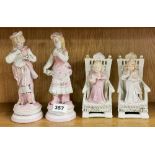 A pair of 19th Century French bisque porcelain figurines, and a further pair of glazed figures of