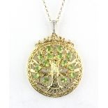 A 925 silver gilt peridot set 'Tree of Life' pendant, with matching chain. Pendand dia. 3.8cms chain