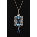 An 18ct white gold (stamped 750) pendant set with a large 32.5ct blue topaz and diamonds, approx.