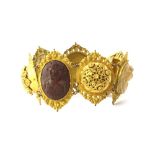 A superb Victorian gilt metal "Grand Tour" Lava cameo bracelet, closed L. 19cm. W. 4cms