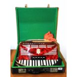 A Bandmaster vintage piano accordion and case.