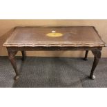 An inlaid mahogany coffee table with inset glass top, L. 96cm.