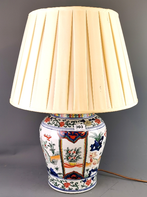 A Chinese hand painted porcelain jar, drilled close to the base and fitted as a table lamp, vase