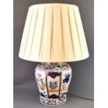 A Chinese hand painted porcelain jar, drilled close to the base and fitted as a table lamp, vase