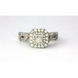 A Vera Wang Platinum (stamped PT950) princess cut diamond set halo ring with diamond set