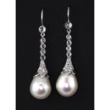 A pair of white metal (tested 18ct gold) large pearl and rose cut diamond set drop earrings.