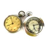 A railway time keeper Cartel Lever pocket watch and an Ingersol pocket watch and cover.