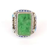 A Chinese enamelled white metal (tested silver) jade set gentleman's ring with symbol of a bat on