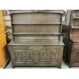 A carved oak Welsh dresser, W. 152cm, H. 168cm.