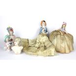 Four porcelain half dolls and one wax torso, tallest of the half doll bodies is 14. cm.