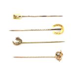 Four 9ct yellow gold stick pins.