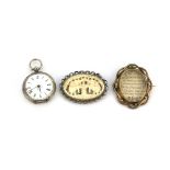 A .800 silver pocket watch, together with a silver mounted ivory brooch and a Victorian yellow metal
